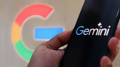 Google Gemini AI logo on a smartphone with Google background