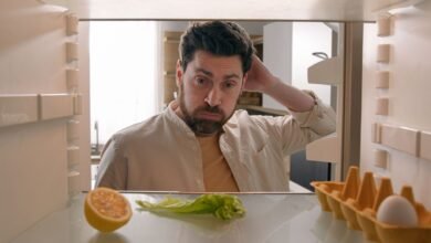 Man looking at fridge