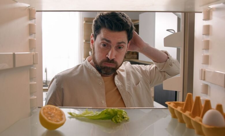 Man looking at fridge